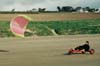 1993. Dominique, full speed, sur une plage de Bretagne. A cette poque, l'aile Wipika fait des merveilles dans ce sport terrestre.